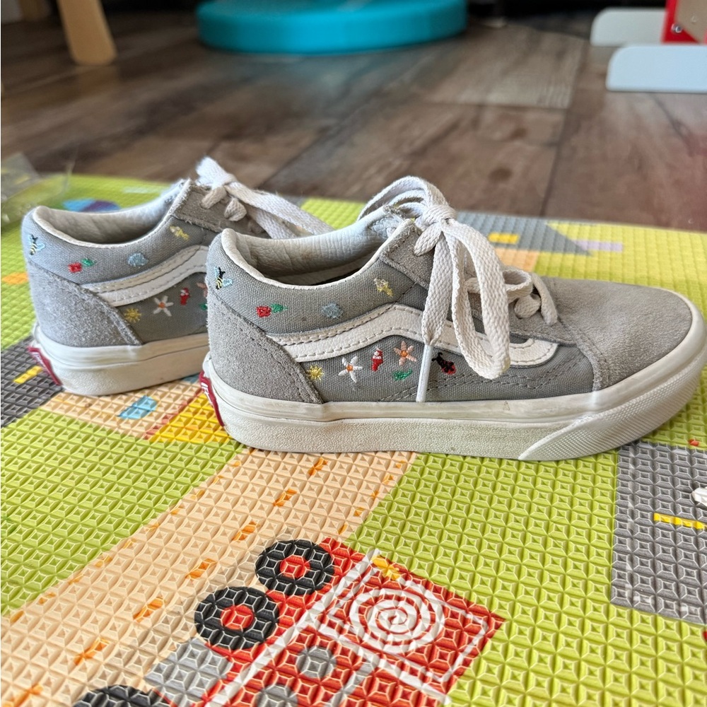 Grey vans with embroidered bugs / insects and plants.